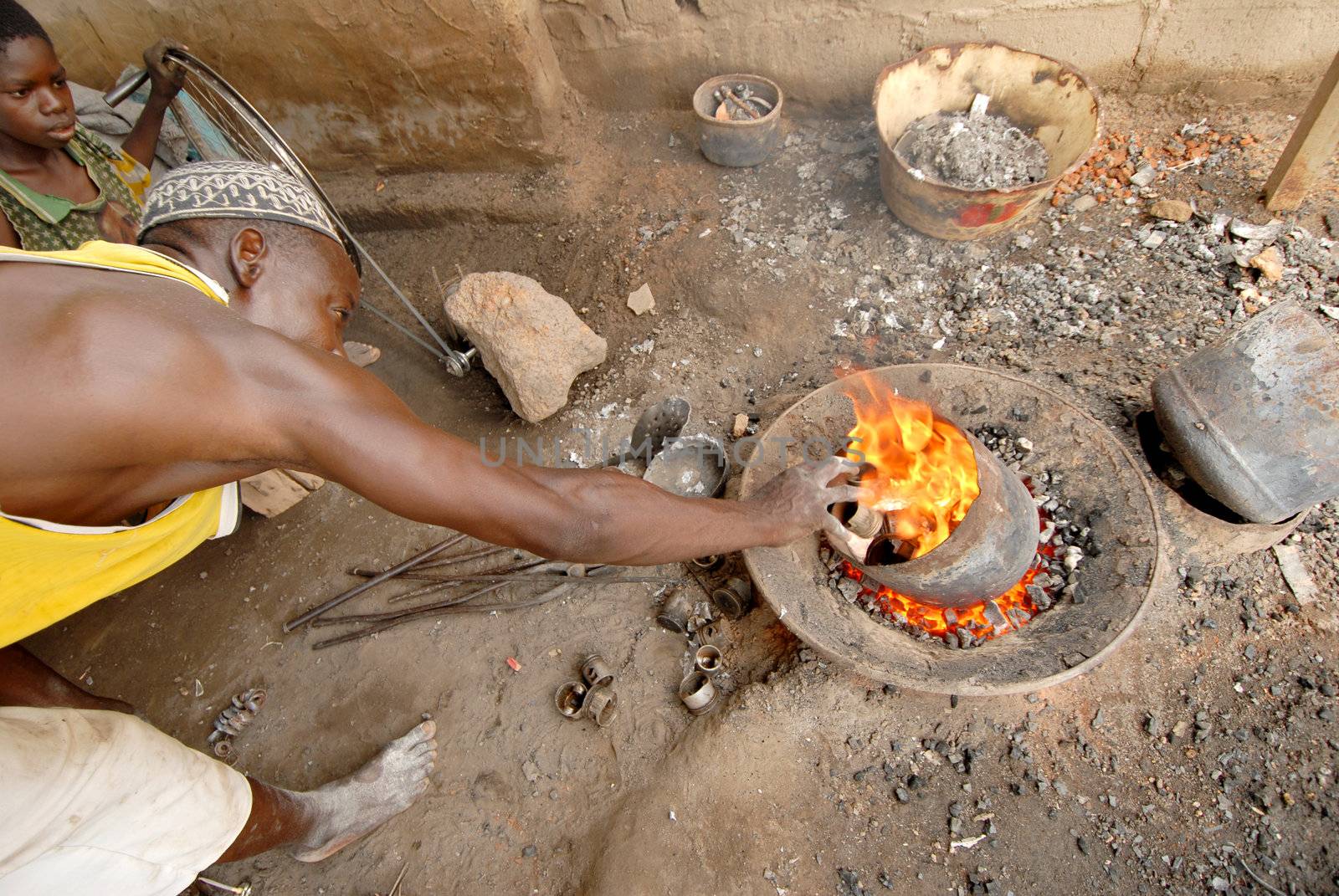 Ouagadougou, Burkina Faso - November 13, 2010:An African blend of soft drink cans.The molten metal will be used to build pots.The fabrication of the cookware is profitable operations in Burkina Faso.
Originate from individual craftsmen, and requiring small investments,