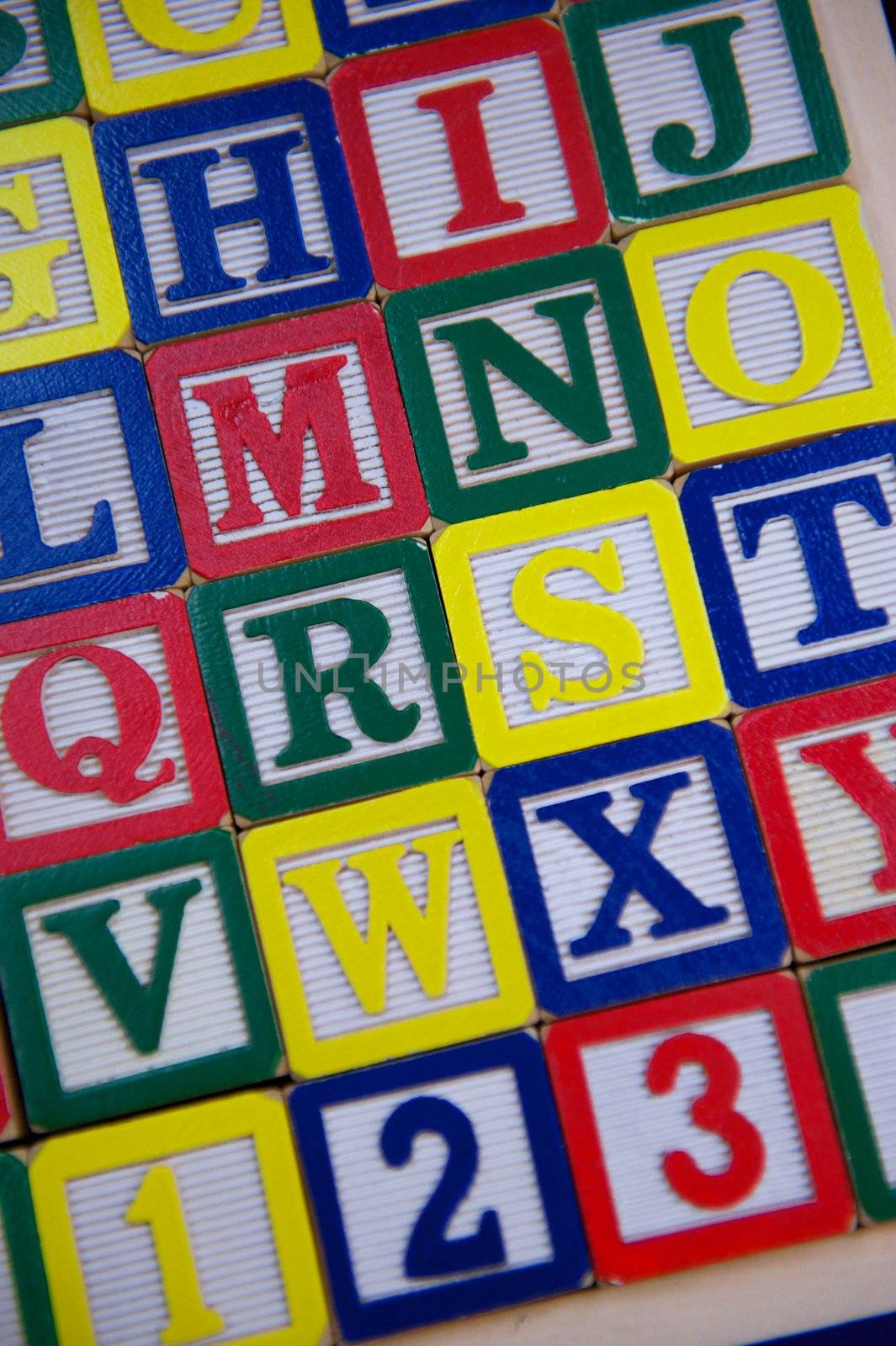 Rows of Brightly Colored Children's Wooden Alphabet Blocks