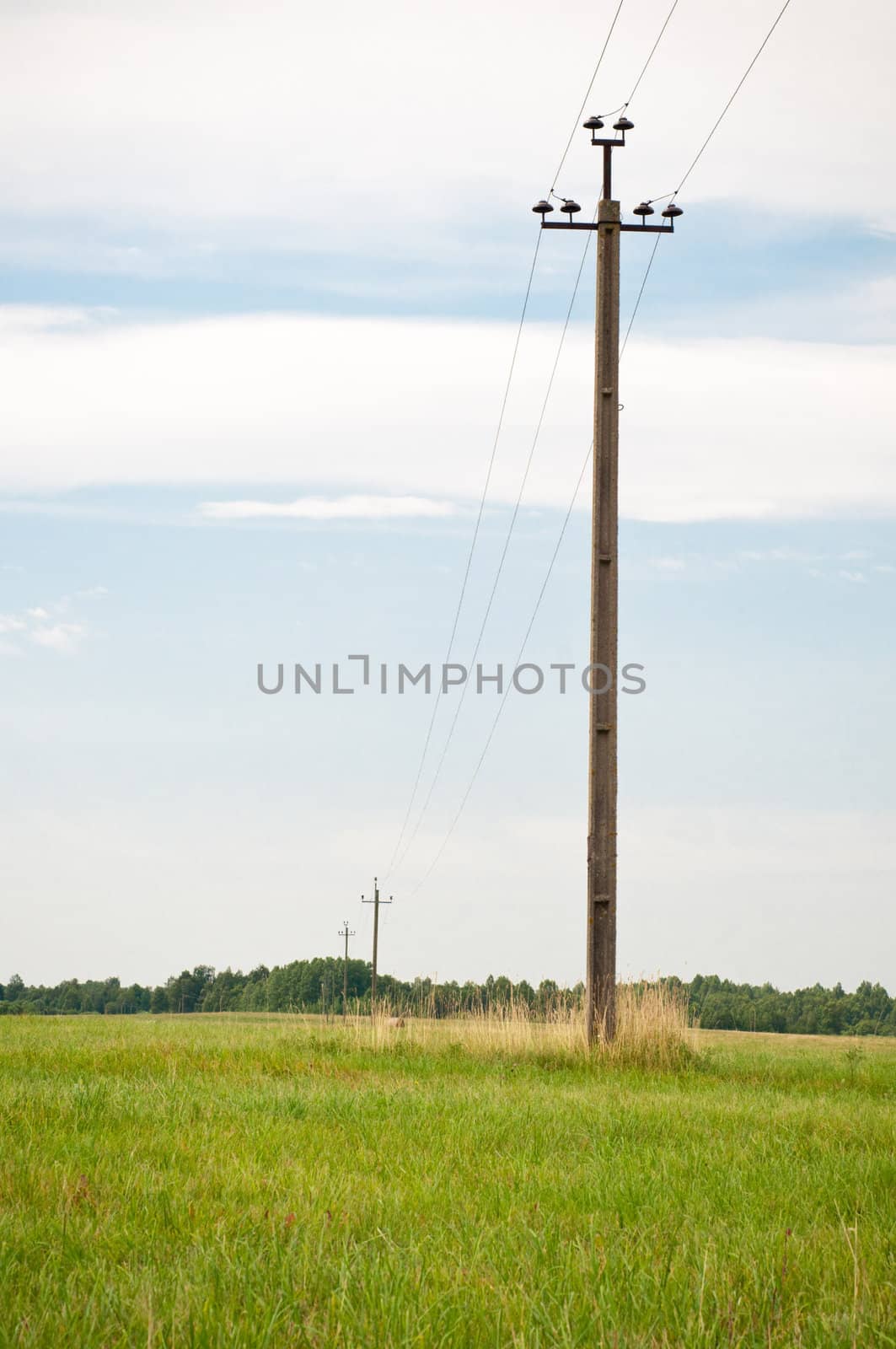 Shot of electric pole, countryside landscape, summer