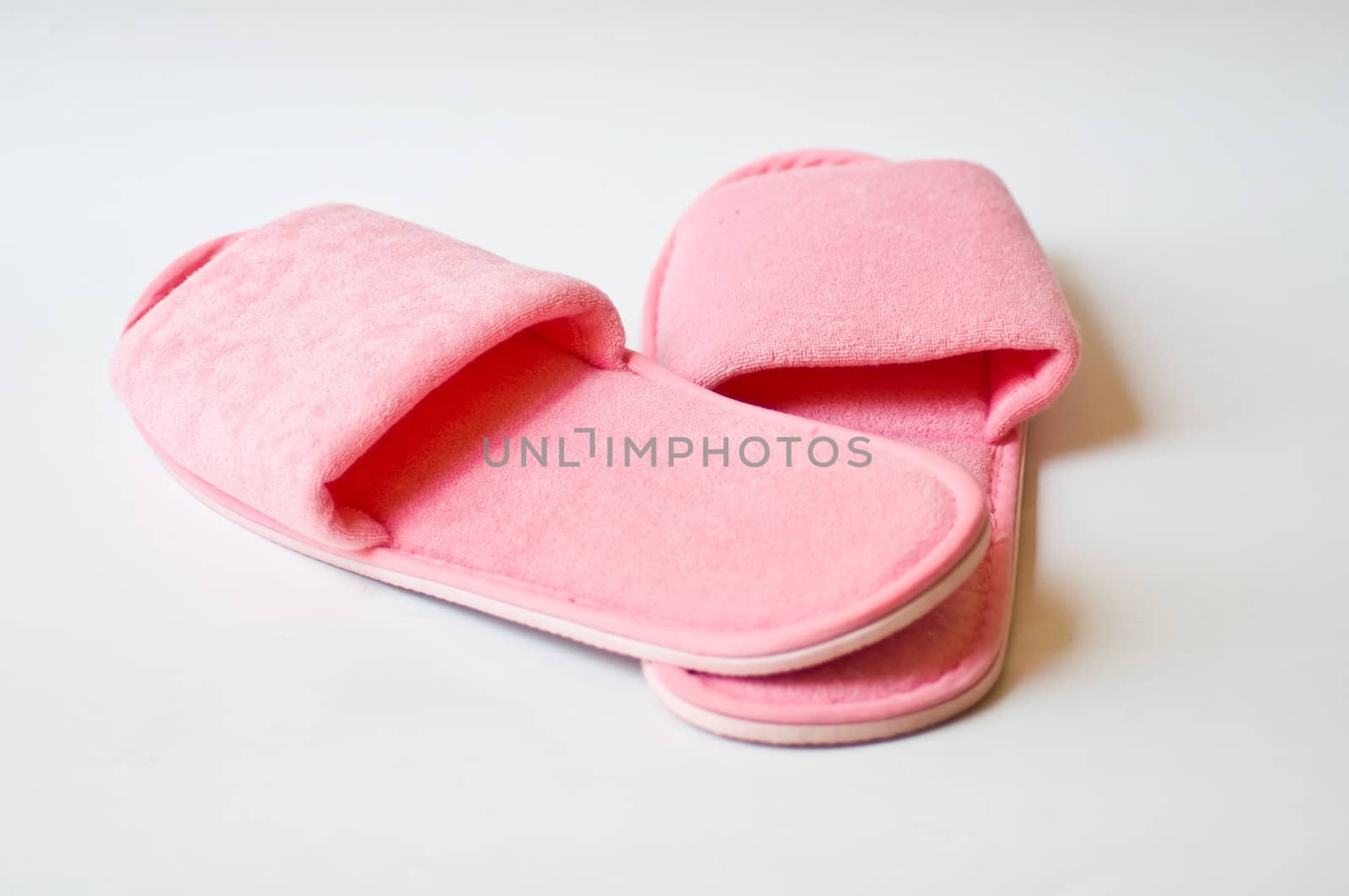 pink slipper on white background