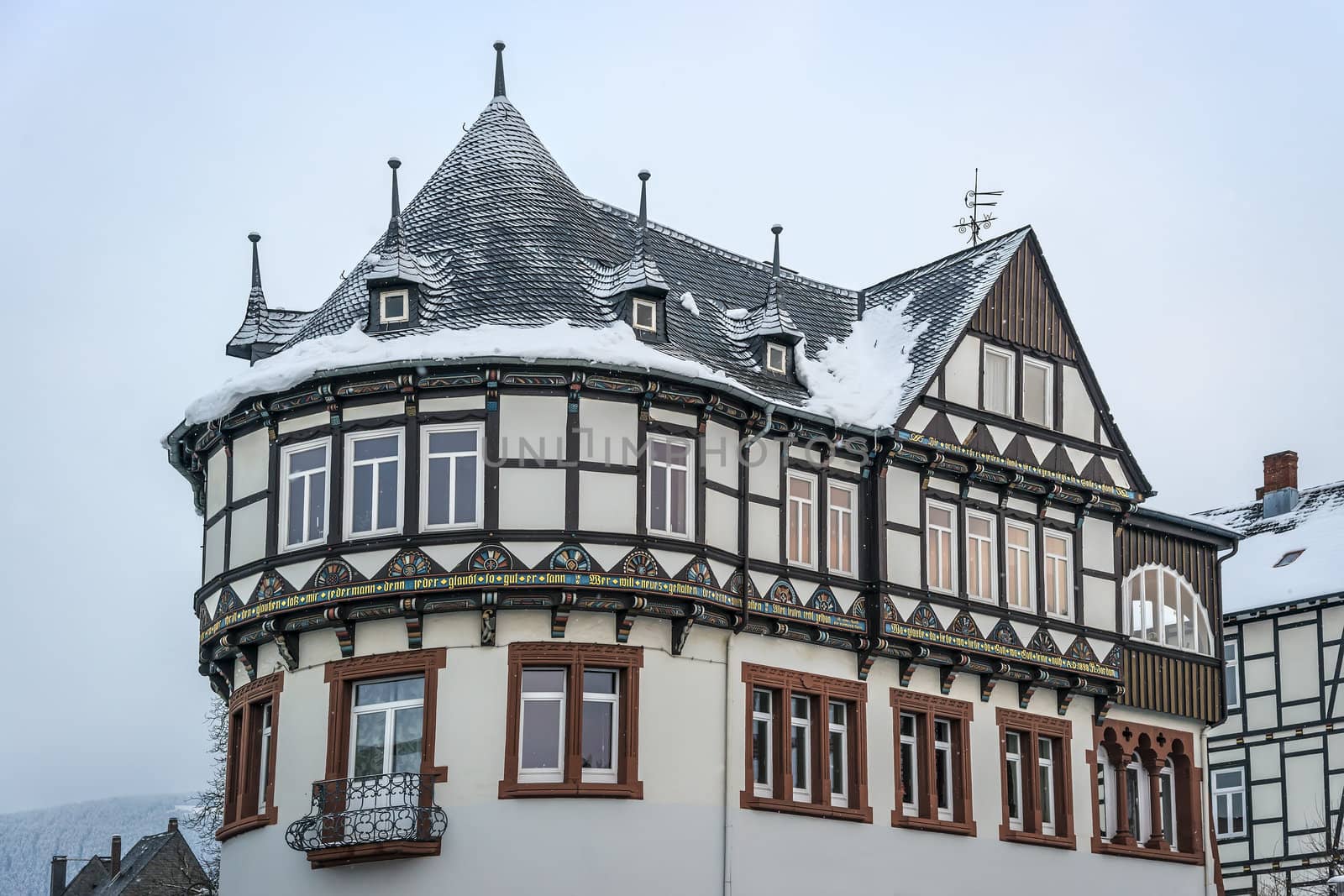 Detail view of a half-timbered house with snowfall in Goslar, Germany