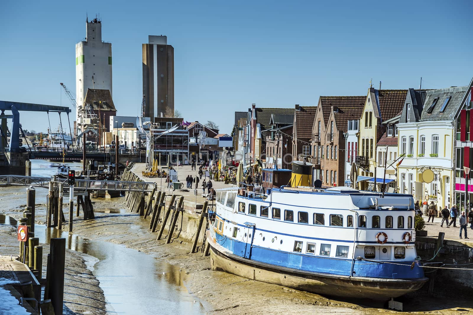 View of the port of Husum at low tide on a sunny day in spring.