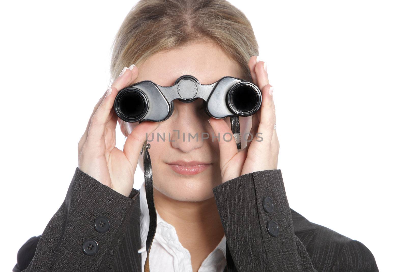 Stylish blonde woman looking through a pair of binoculars facing directly into the lens