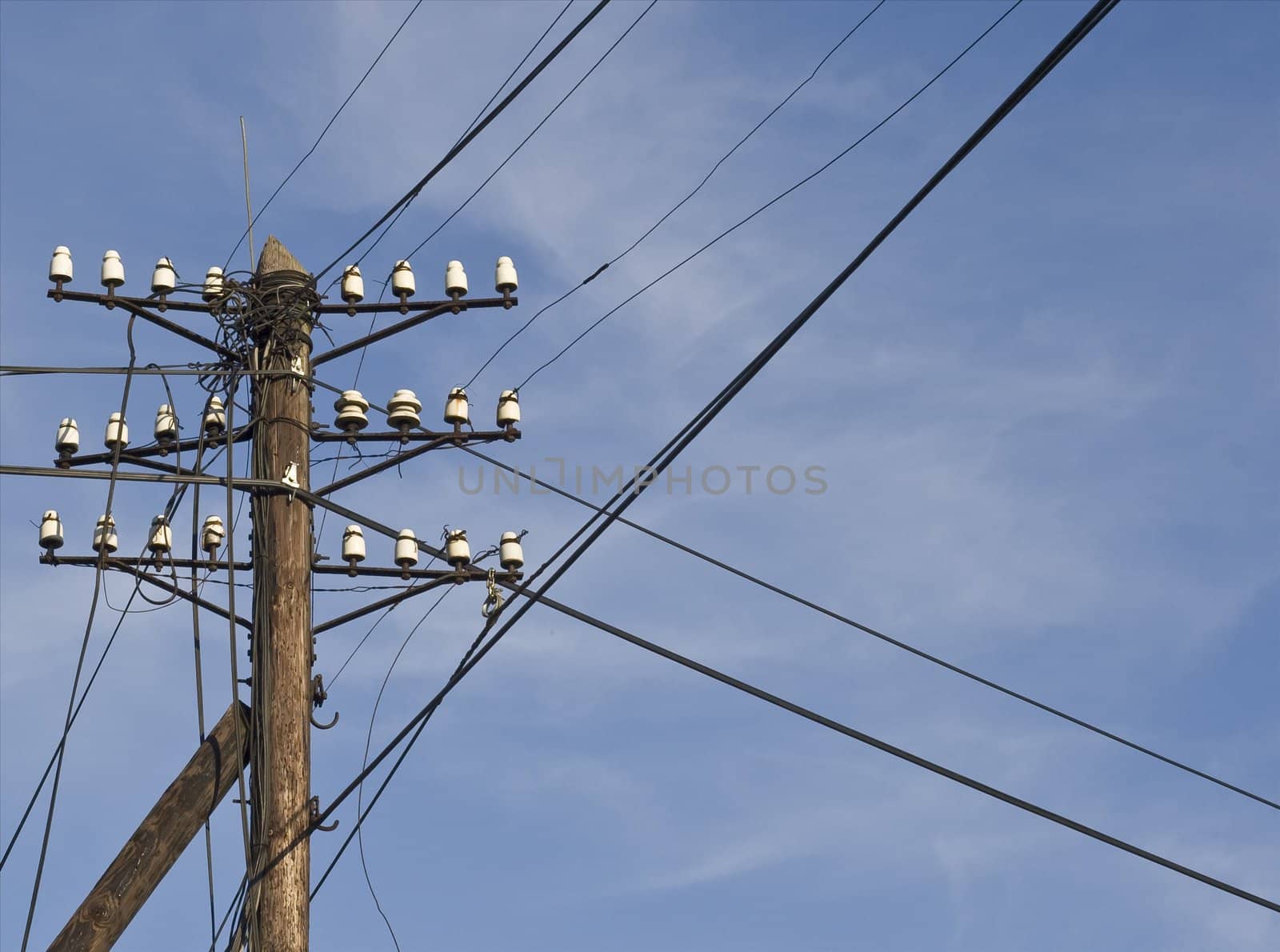 Power lines on the blue sky