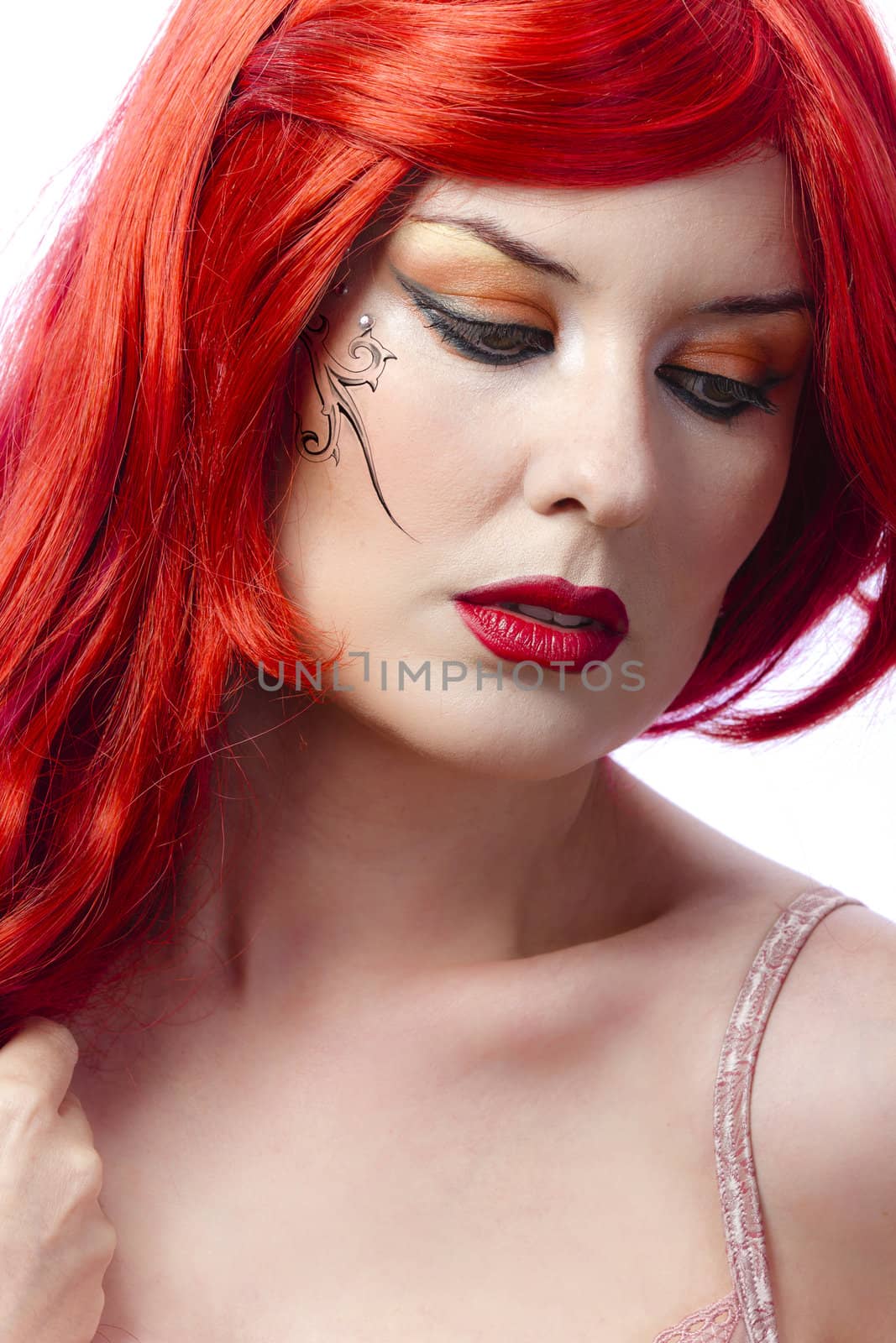 Red haired tattooed woman over white background