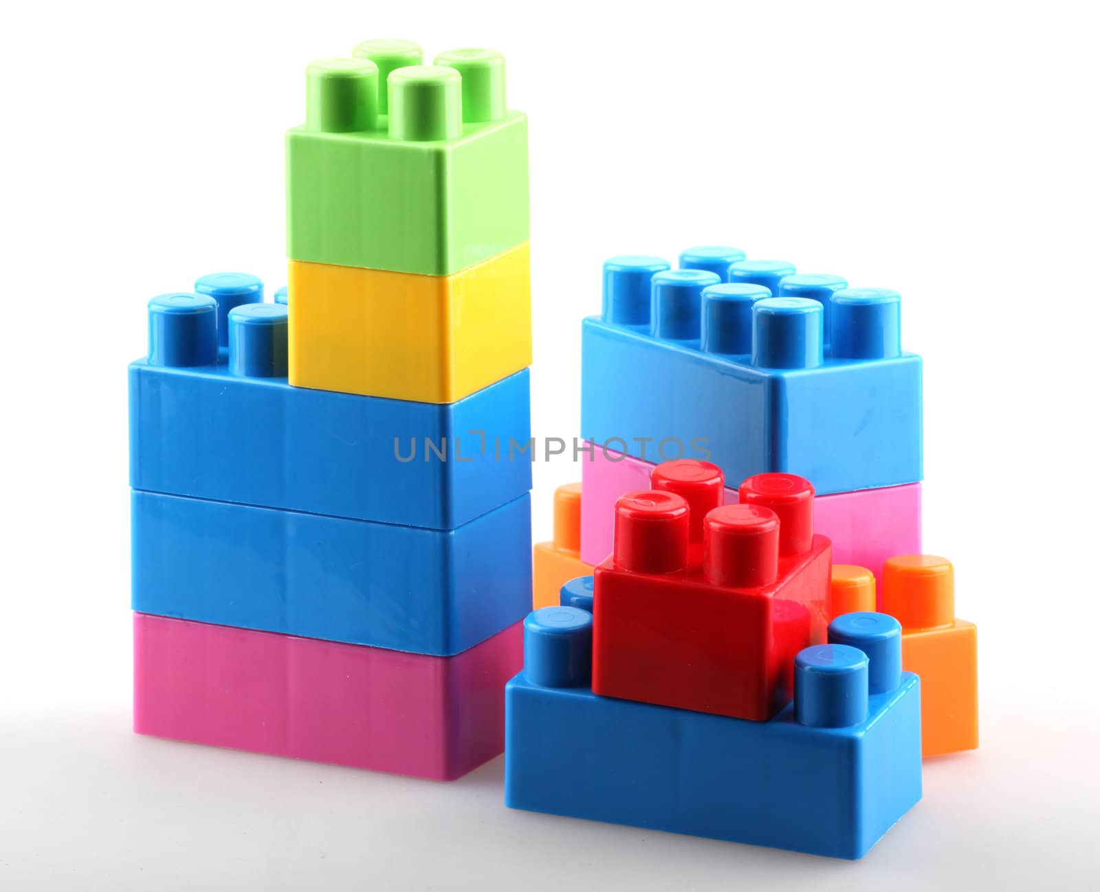 Plastic building blocks isolated on white background.