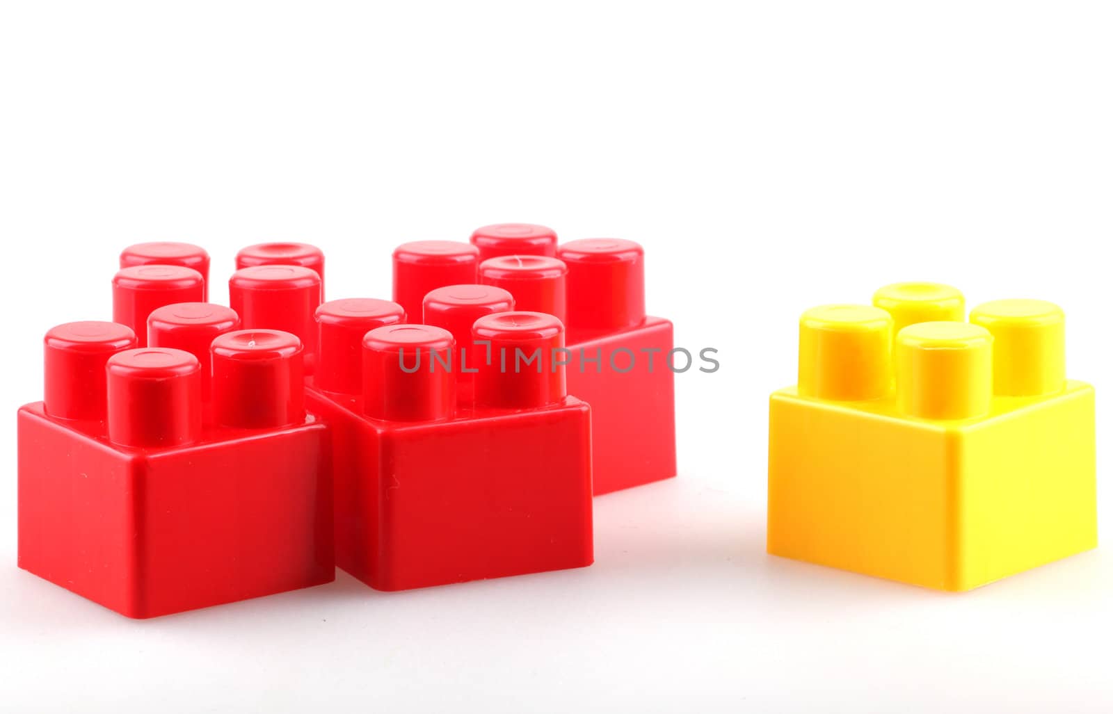 Plastic building blocks isolated on white background.