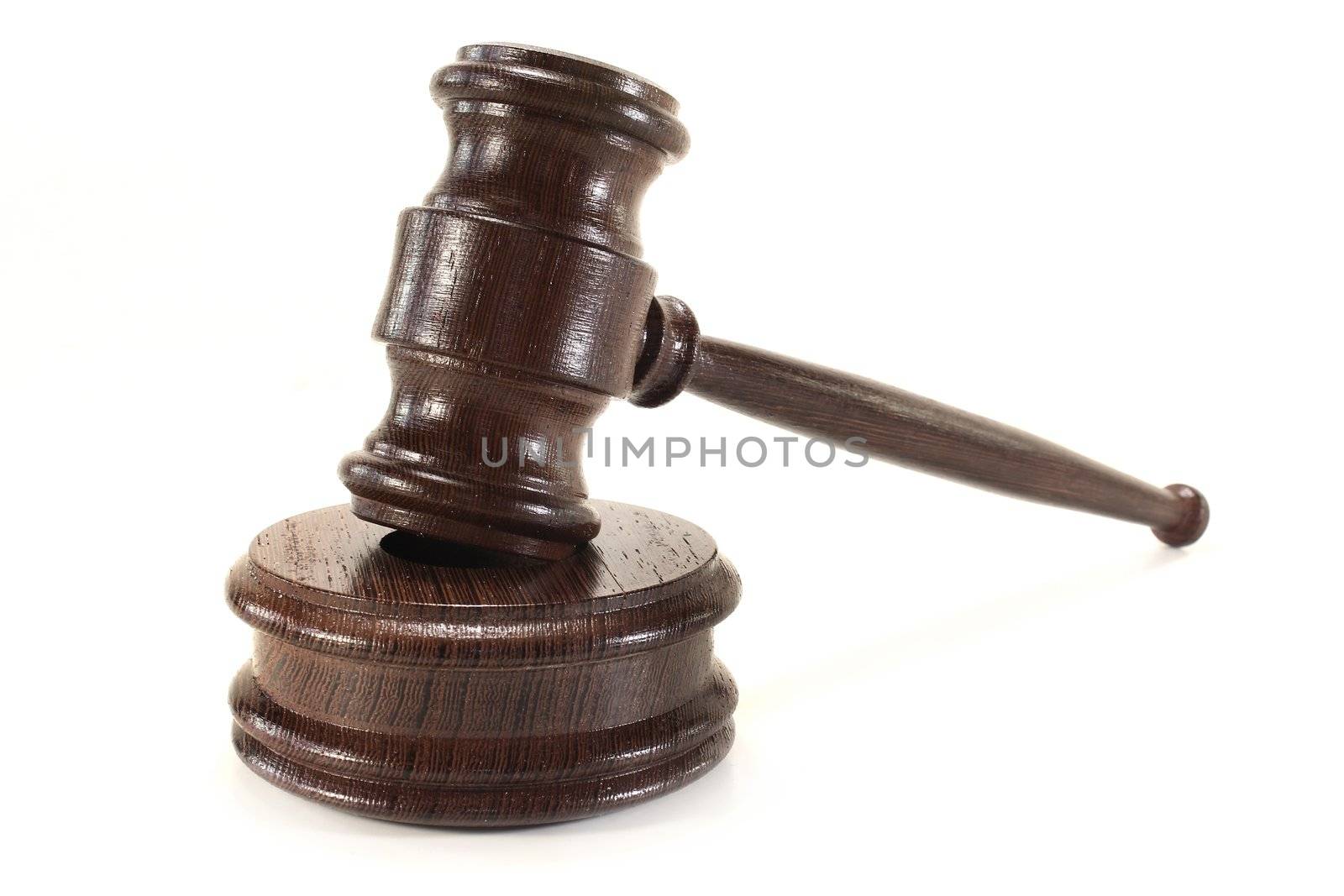 a brown judge's gavel on a white background