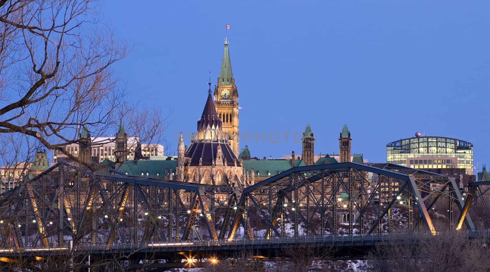 The canadian Parliament seen behind the Alexandra provincial bridge in Ottawa during the twilight hour.