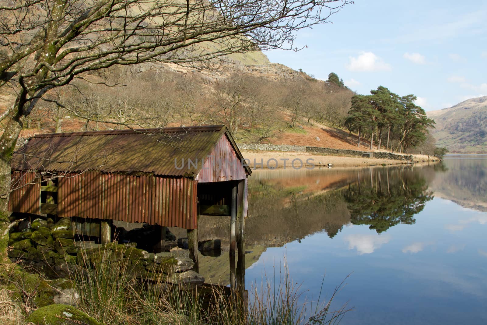 Boathouse on lake. by richsouthwales