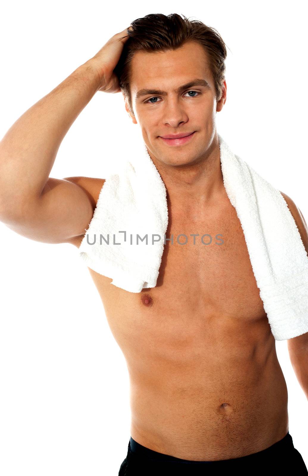 Handsome young shirtless man with white towel around his neck
