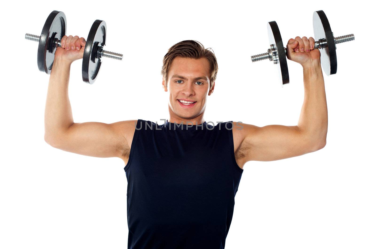 Caucasian athlete exercising in sporty outfits, lifting weights