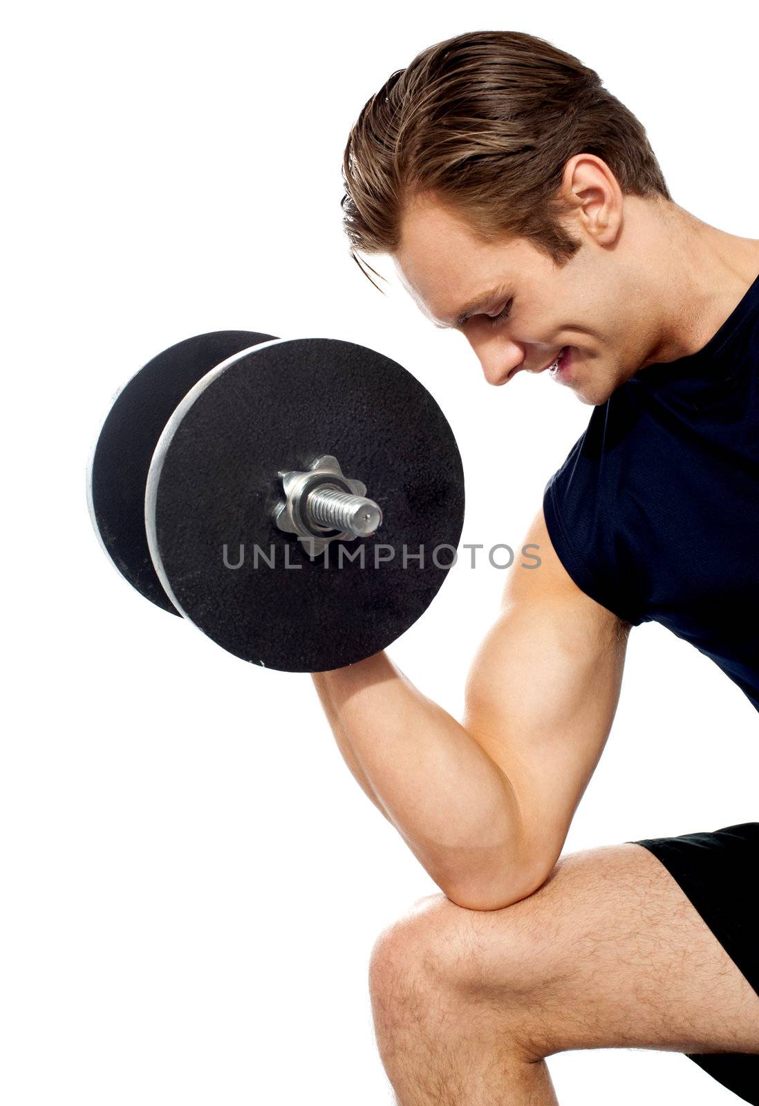 Portrait of young fit trainer working out with dumbbells isolated over white