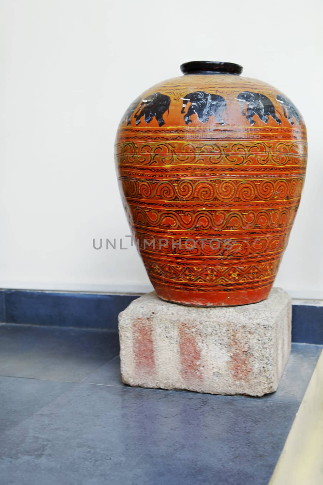 Rajasthan, India, Vertical portrait of a clay terracotta ornate hand painted receptacle made by local cafts paerson