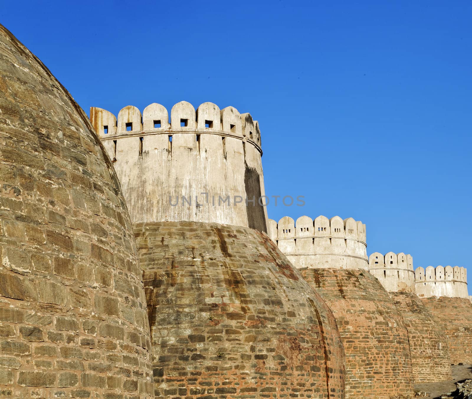 Exterior walls of Kumbhalghar Fort built in the 9th century and of Indian historical significance, bastions and public footpath and curved features to towers