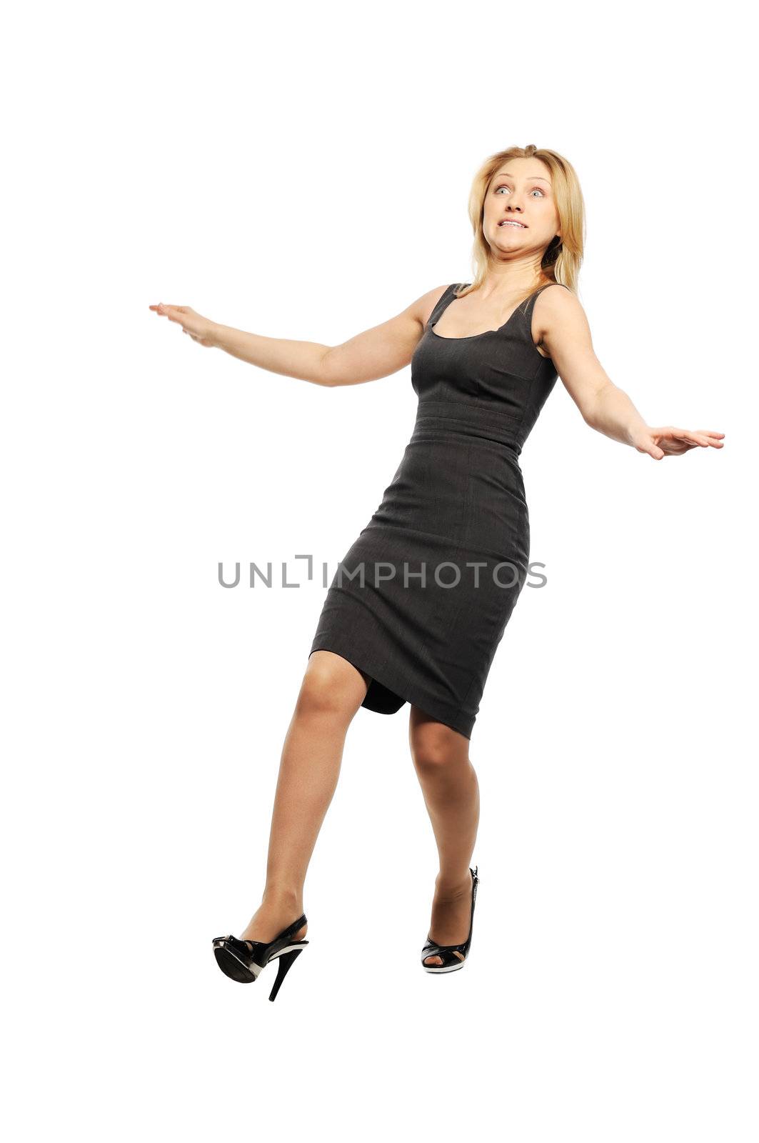 Beautiful young woman stands with falling back pose