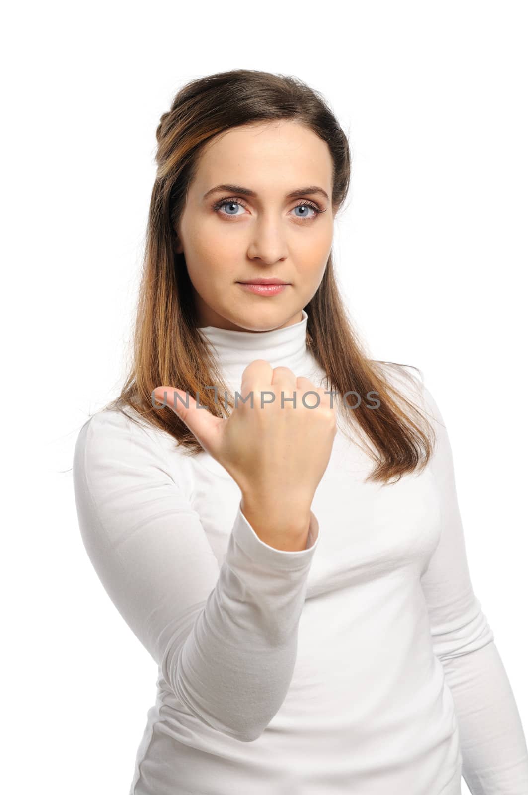 Young attractive girl shows gesture of the figure one. Isolated on white.