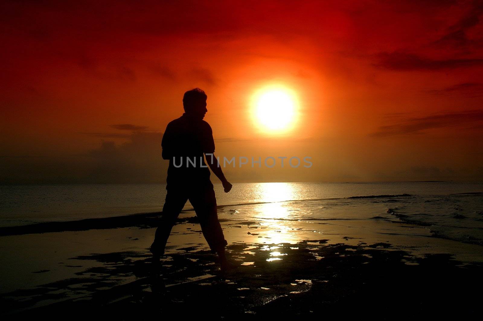 silhouette of a warrior with a sunrise background                    