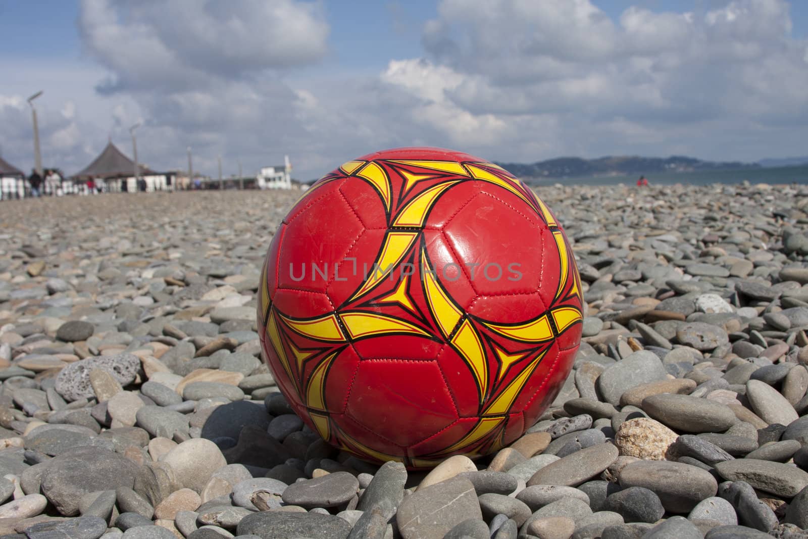 A football on a stony beach