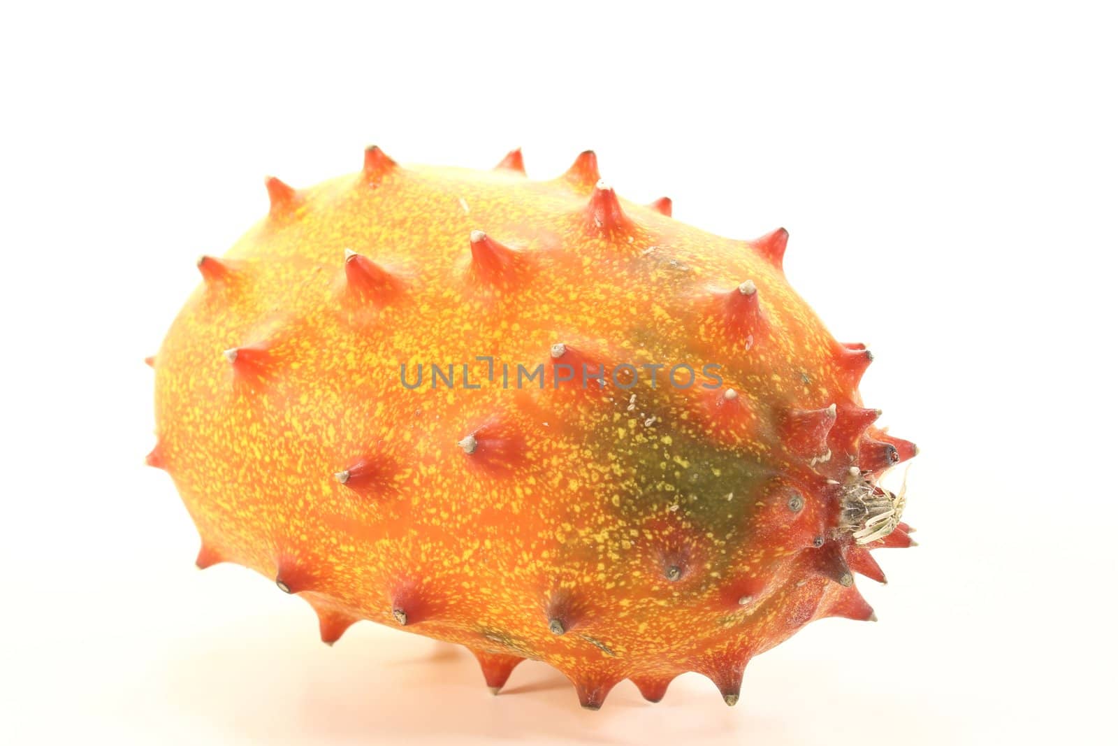 fresh orange Kiwano on a light background