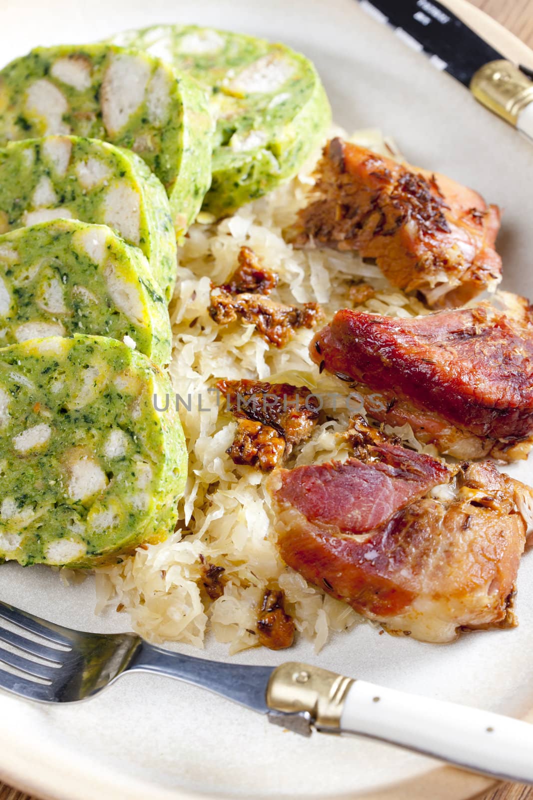 pork meat with herbal dumplings and cabbage