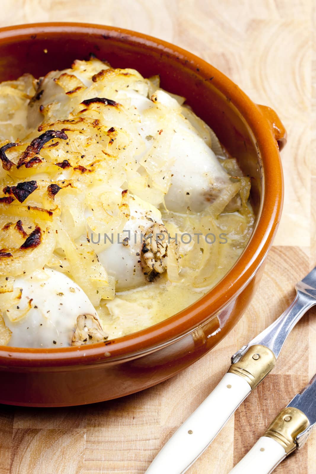 sepias filled with pearl barley baked with onion