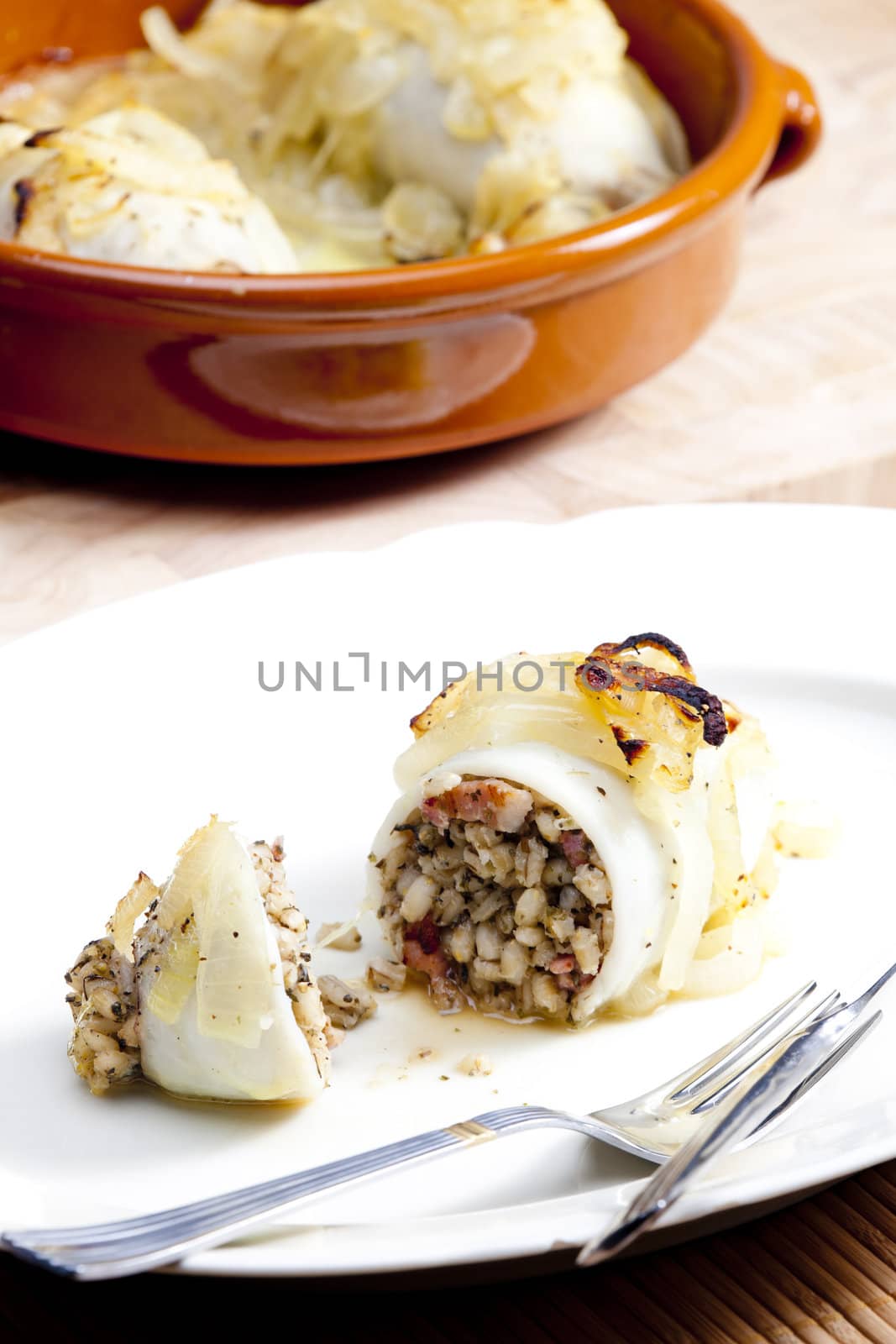 sepia filled with pearl barley baked with onion