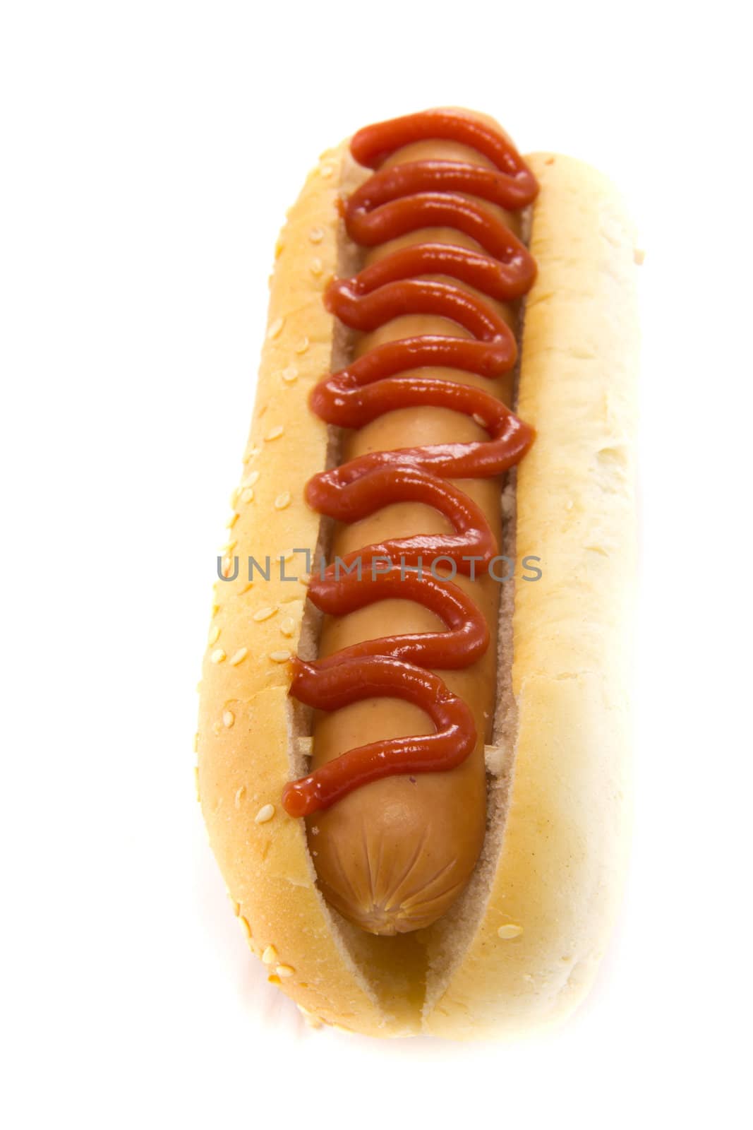 A picture of a hotdog with ketchup on top