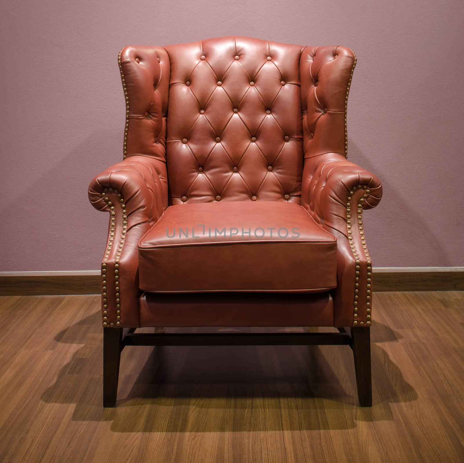 Front of Classic Chesterfield luxury Brown Leather armchair by nuttakit