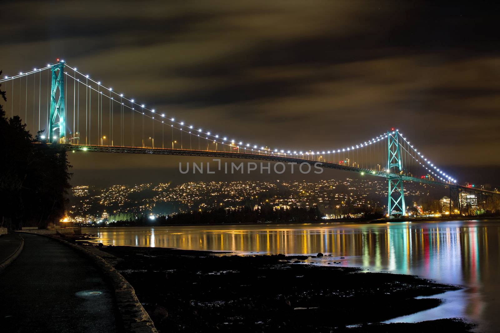 Lions Gate Bridge Over English Bay in Vancouver BC Canada at Night