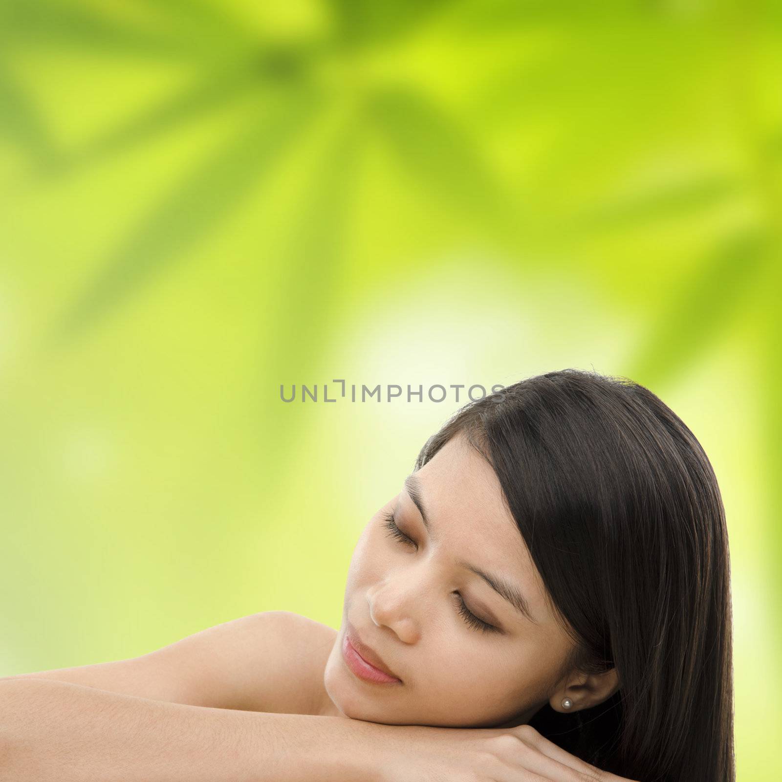 Beautiful Asian Girl having a relaxing time in beauty spa