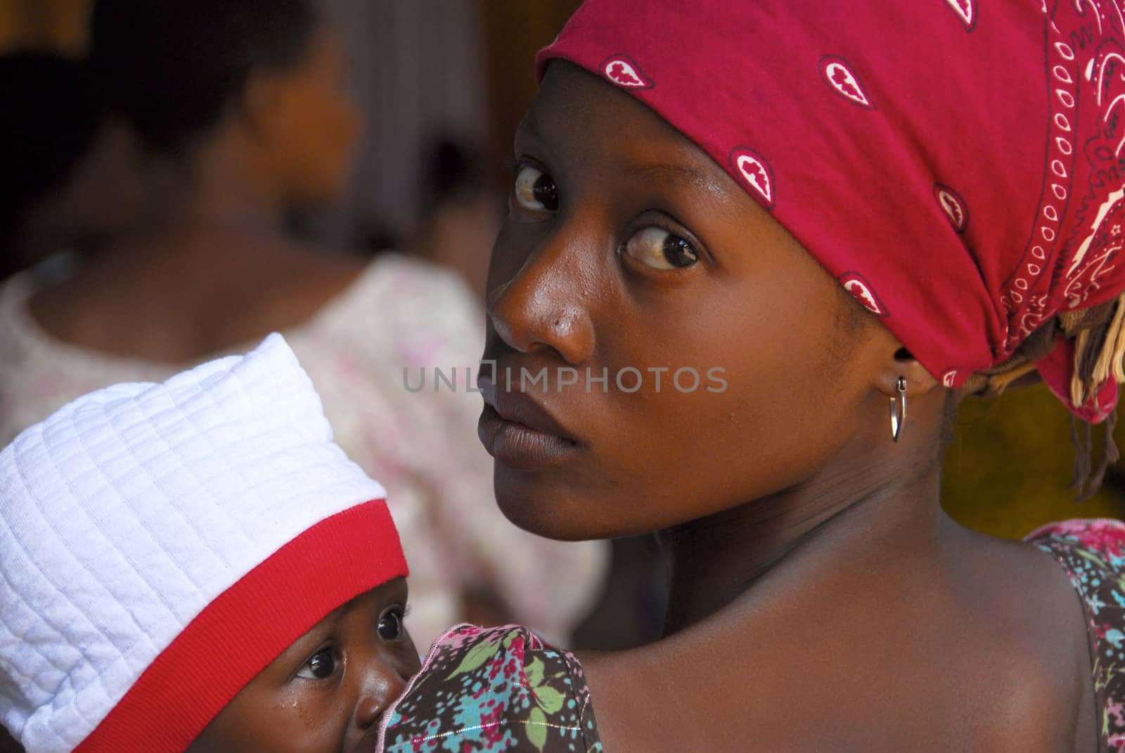 Mwanza, Tanzania- 21February, 2010: close-up of a young mother with her baby in Evangelist  church