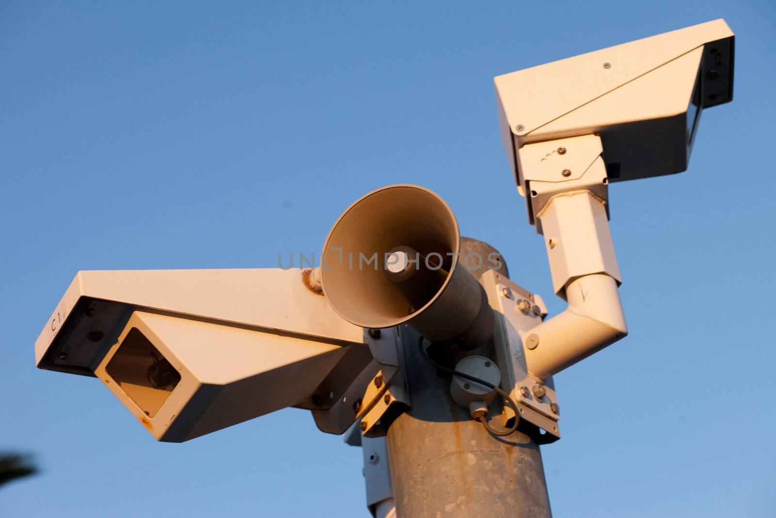 Security cameras and warning loudspeaker in afternoon
