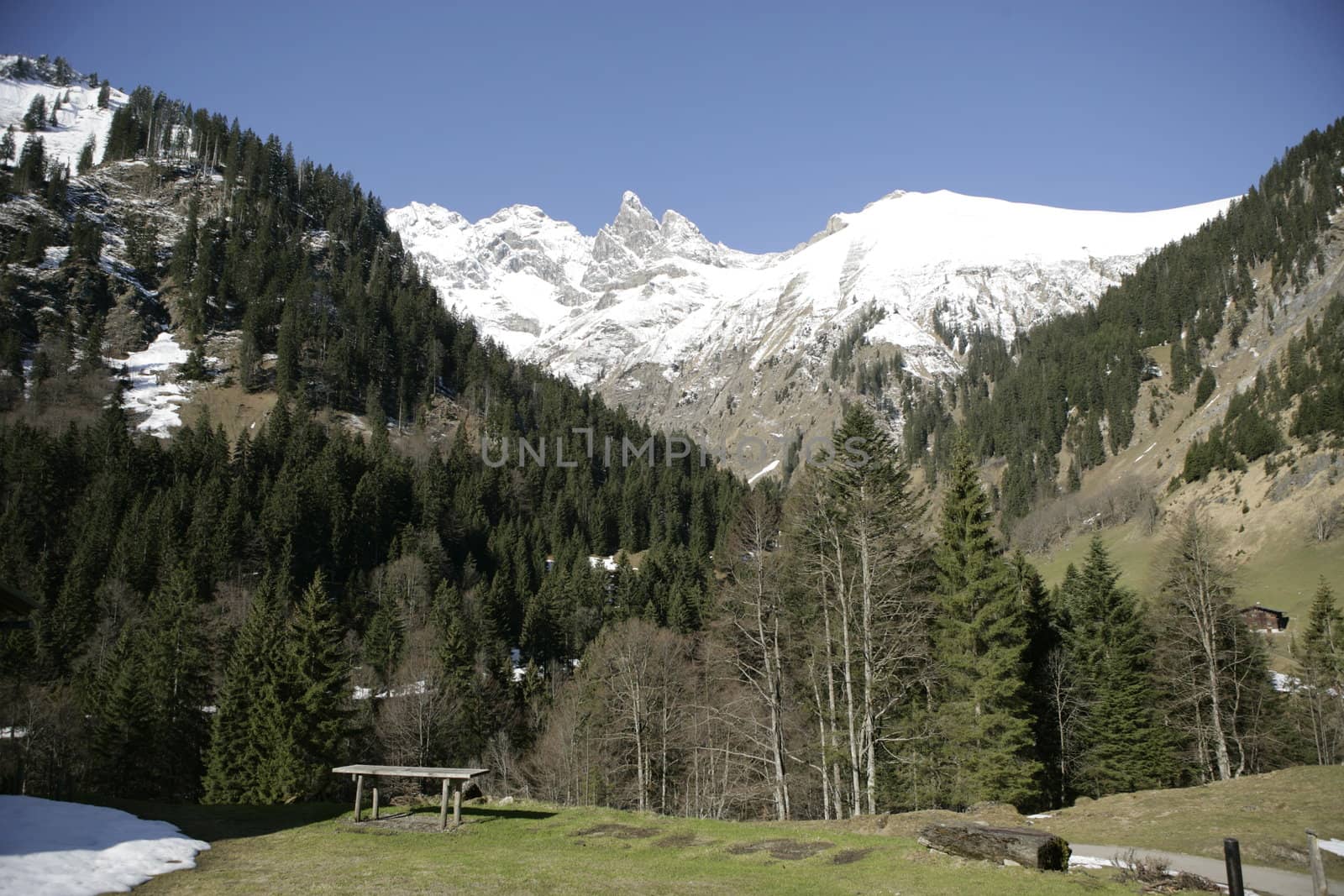 Picture of a mountain with snow on the peak outside..