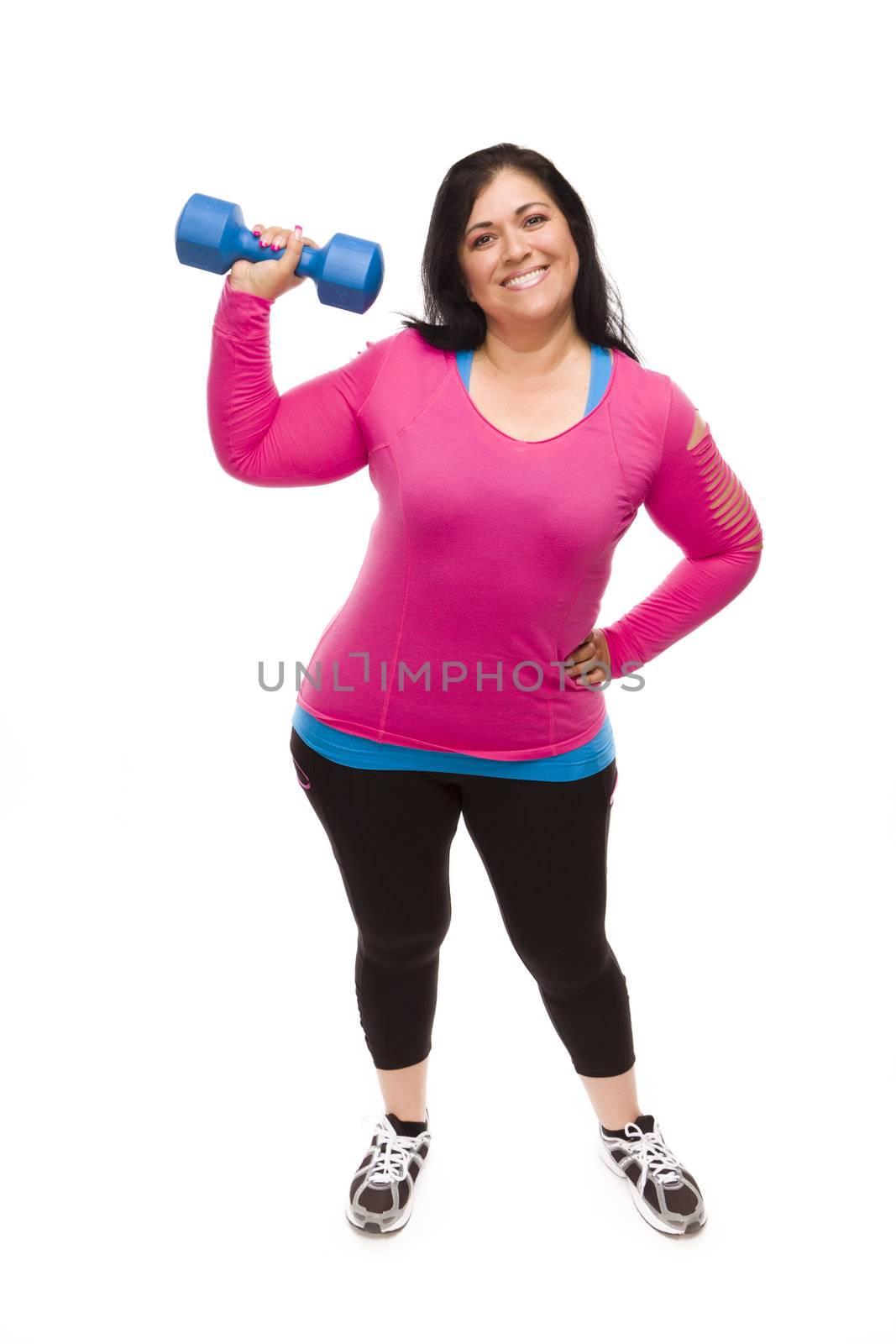 Attractive Middle Aged Hispanic Woman In Workout Clothes Lifting Dumbbell Against a White Background.