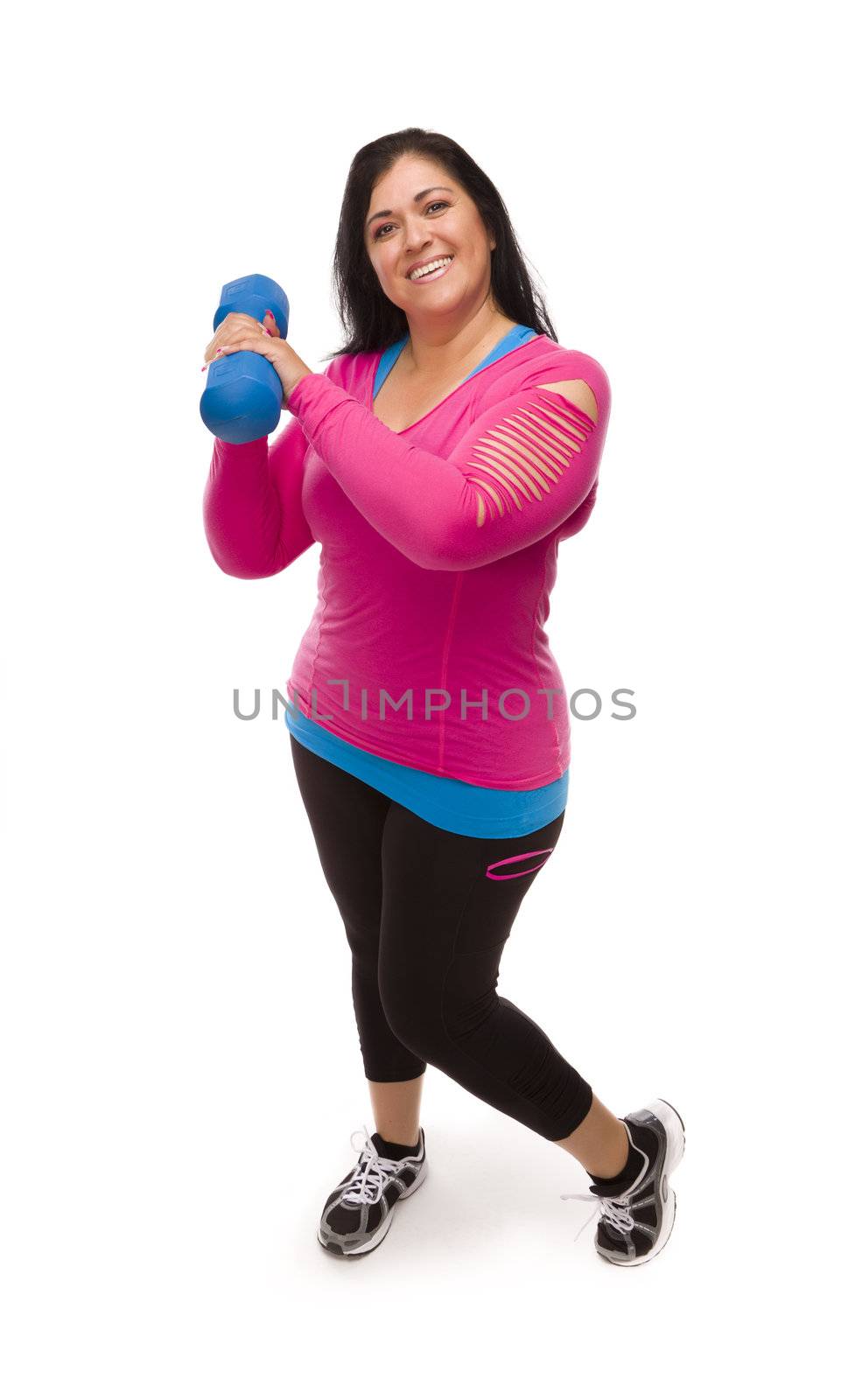 Attractive Middle Aged Hispanic Woman In Workout Clothes Lifting Dumbbell Against a White Background.
