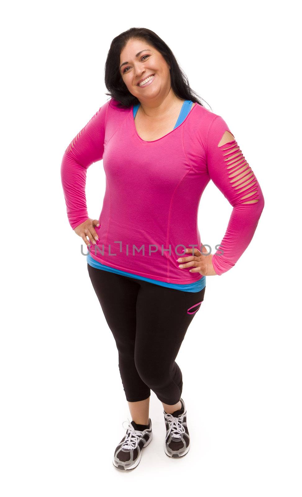 Attractive Middle Aged Hispanic Woman In Workout Clothes Against a White Background.