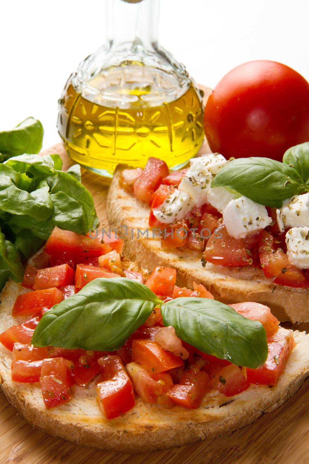 italian bruschetta with fresh tomatoes, basil, garlic, olive oil and cheese