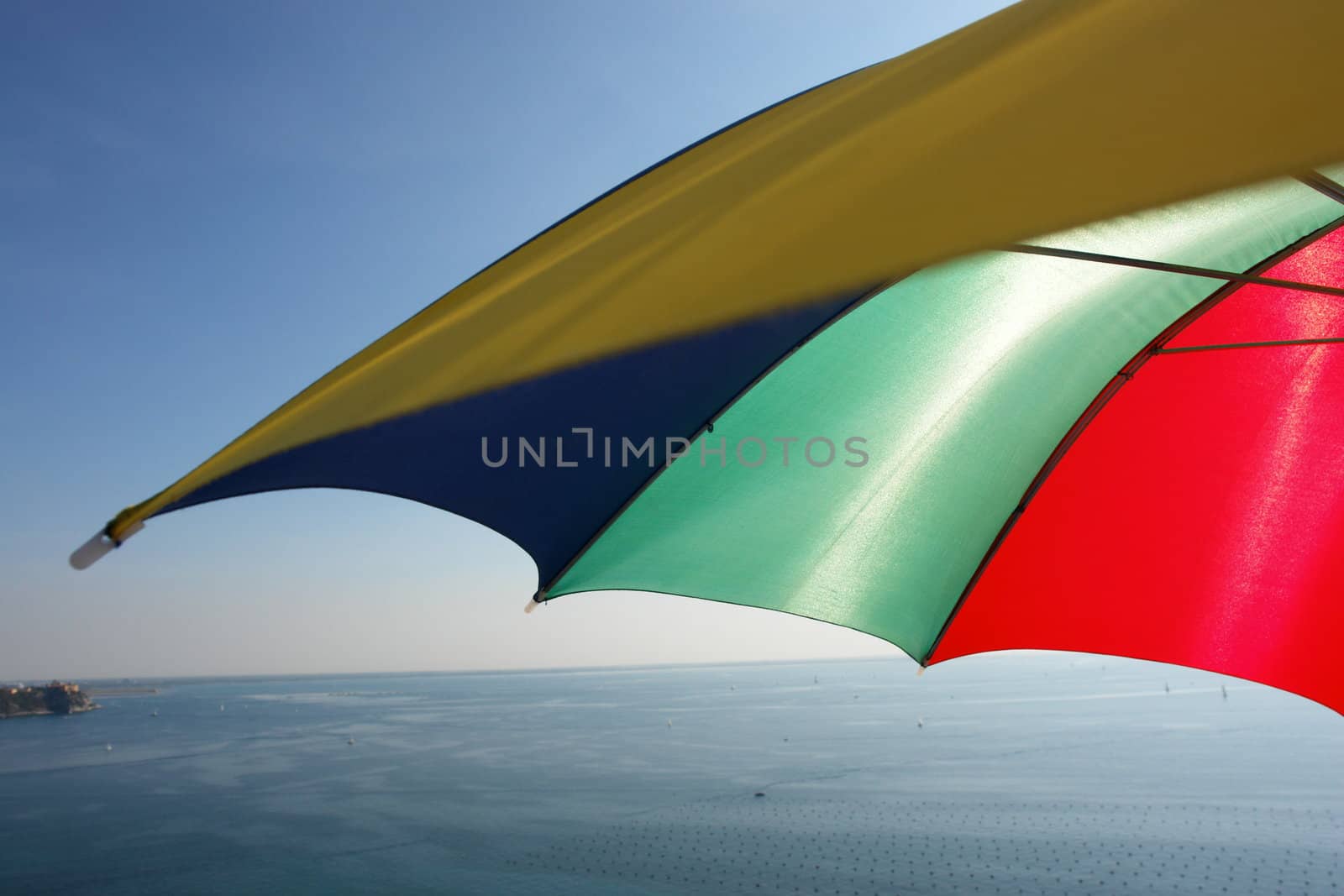 colorful parasol at the ocean on a sunny day