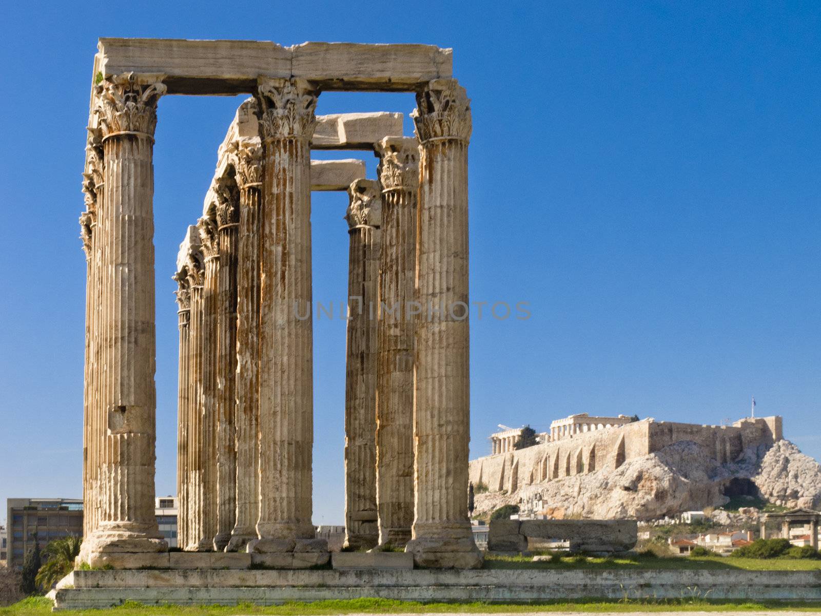 Columns of Olympian Zeus temple, Remains of Olympieion temple and Acropolis on background, Athens, Greece