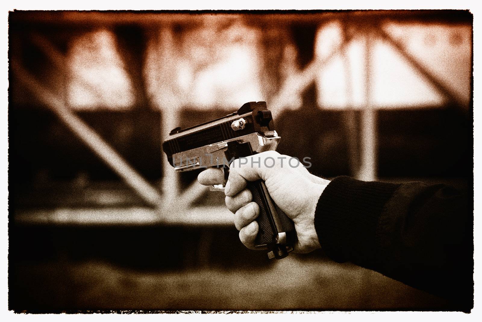 Hand with airgun. Filmgrain and frame added to reflect more violence. Useful concept.