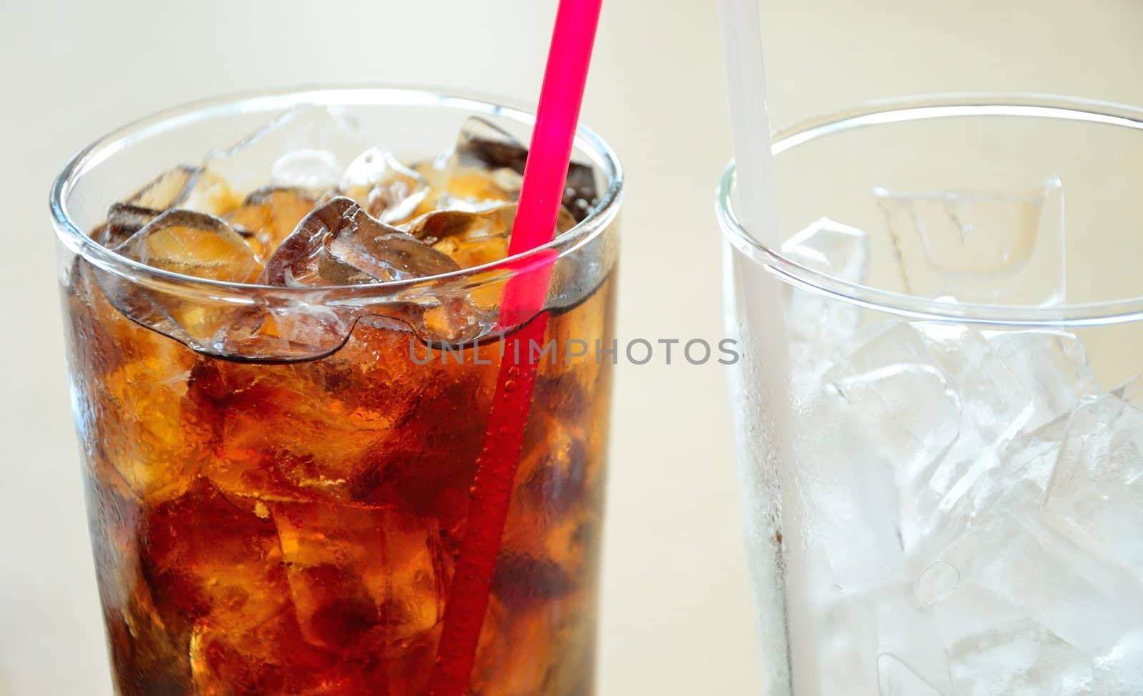 Soft drinks and ice in clear glass