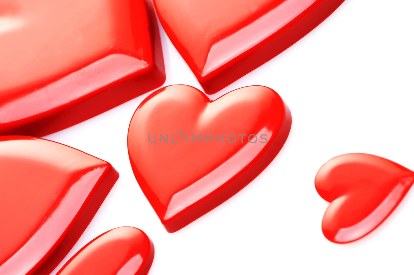 red hearts on white background by stokkete