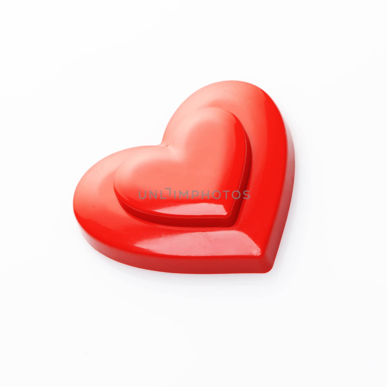 red hearts on white background by stokkete