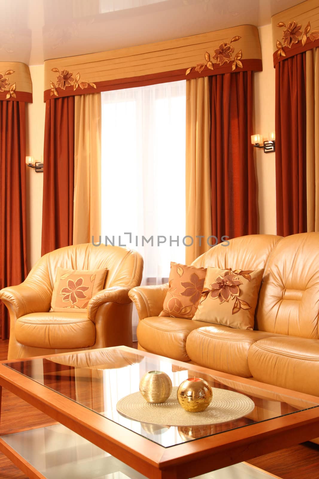 spacious hall with leather sofas and big windows