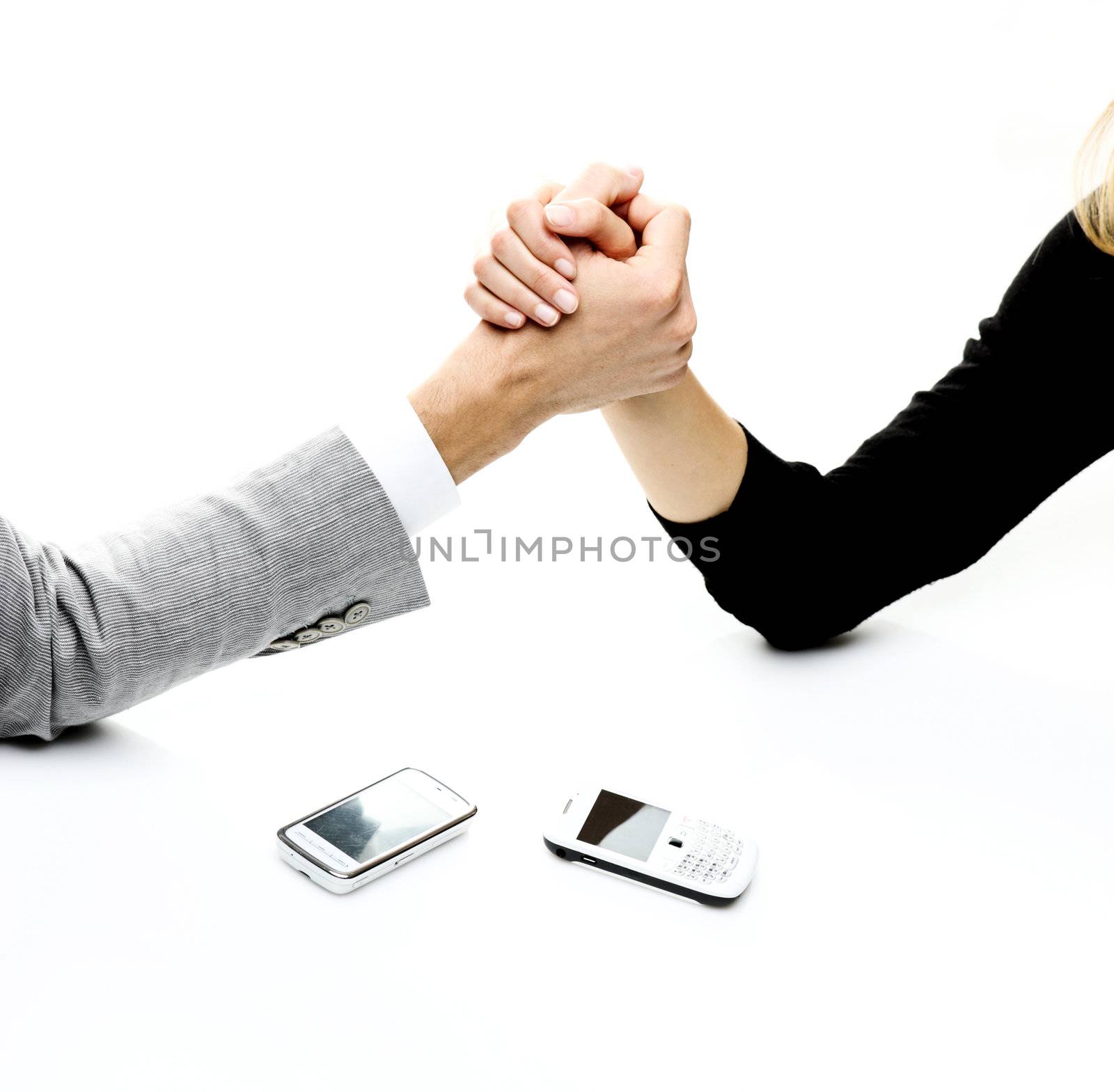 businessman and businesswoman arm wrestling on table. 