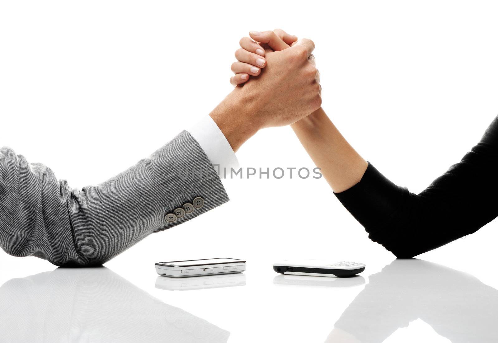 businessman and businesswoman arm wrestling on table. 