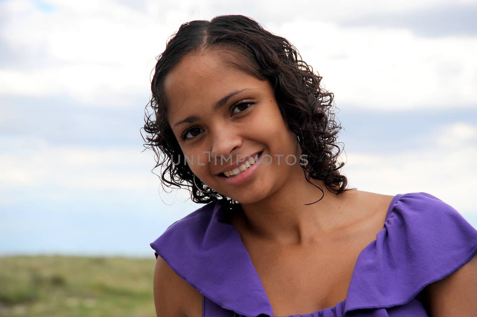 African american female beauty posing outside.