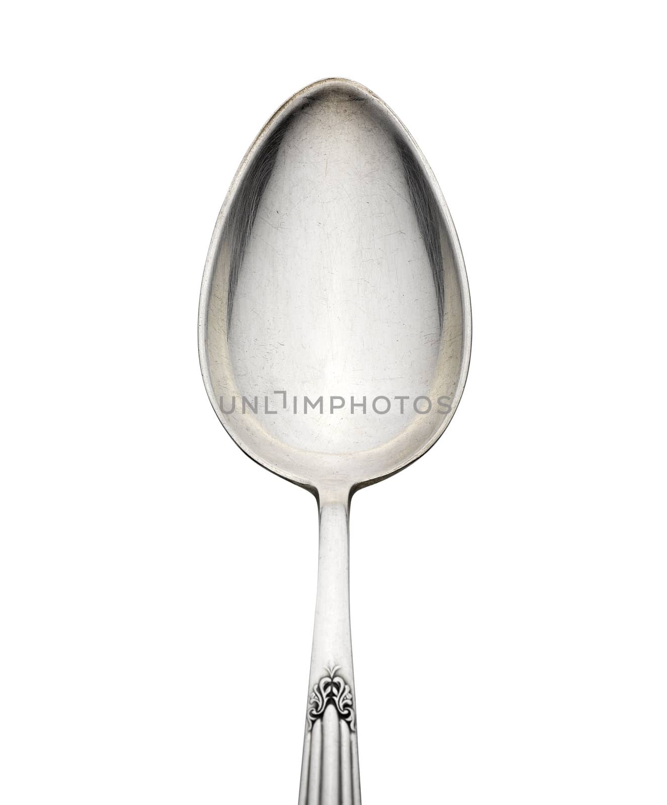 Old silver spoon with ornament isolated on white background by pbombaert