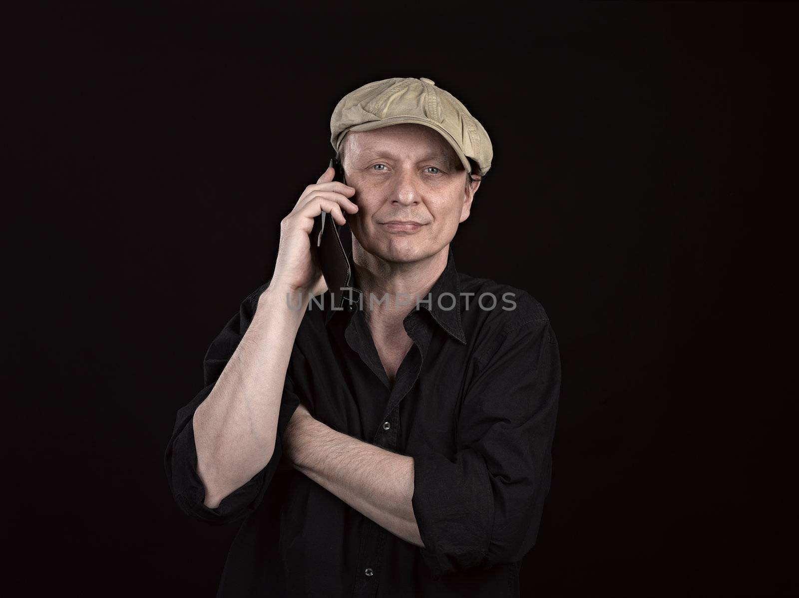 Guy using a mobile phone with copyspace on black
